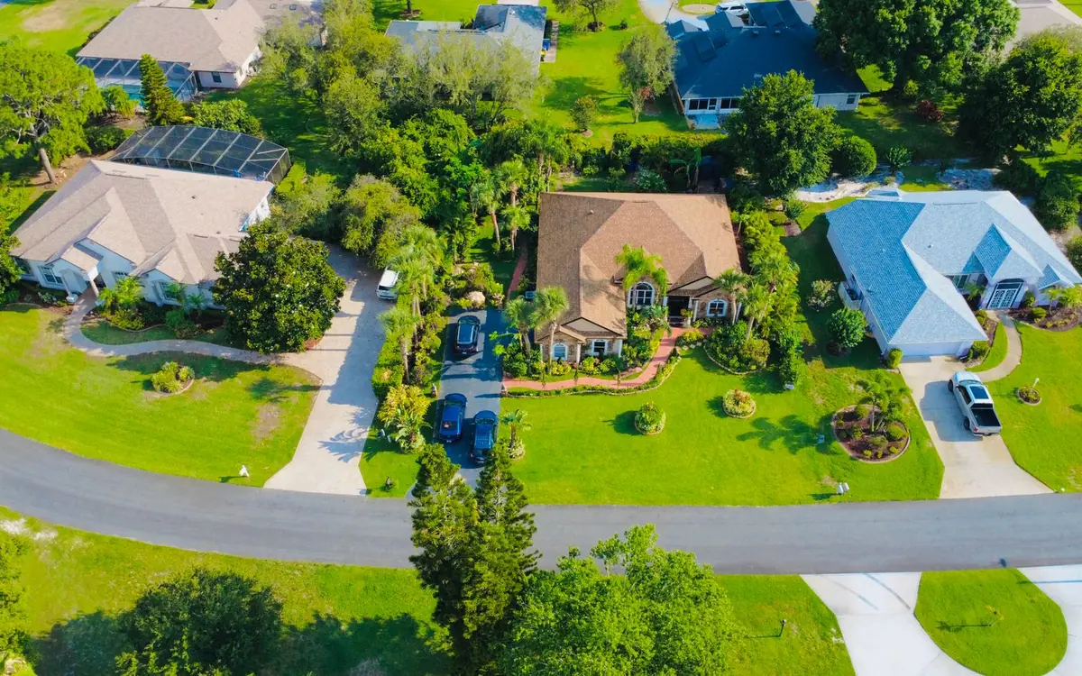 Aerial view of Florida homes with green yards and curving streets